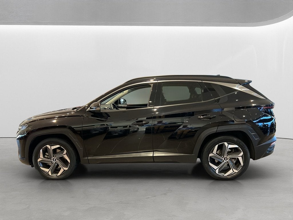 Hyundai Tucson 1.6 T-GDI 265pk PHEV Premium 4WD, Gebruikt, 4 cilinders, Zwart, Bedrijf