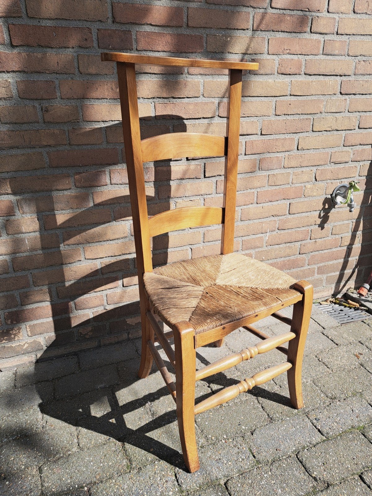bid stoel met biezen zitting, Ophalen