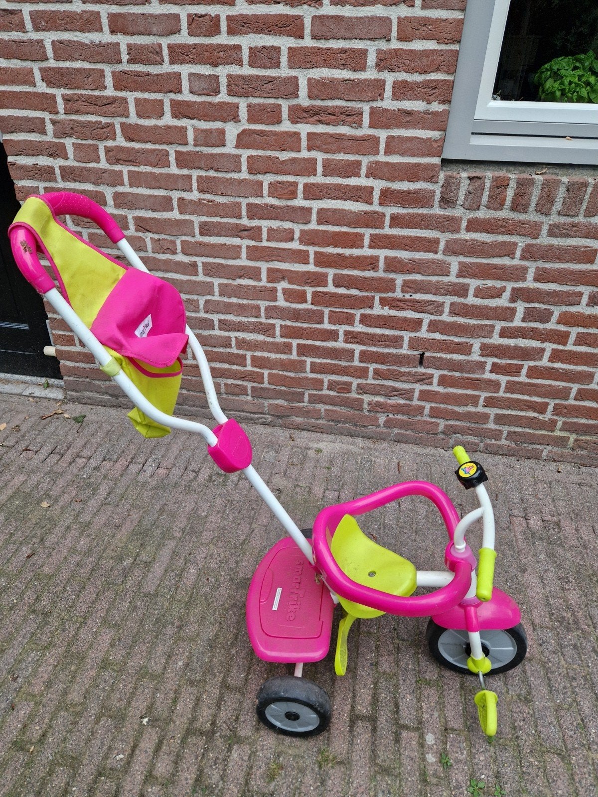 driewieler smart trike  roze/geel met duwstang, Ophalen, Gebruikt