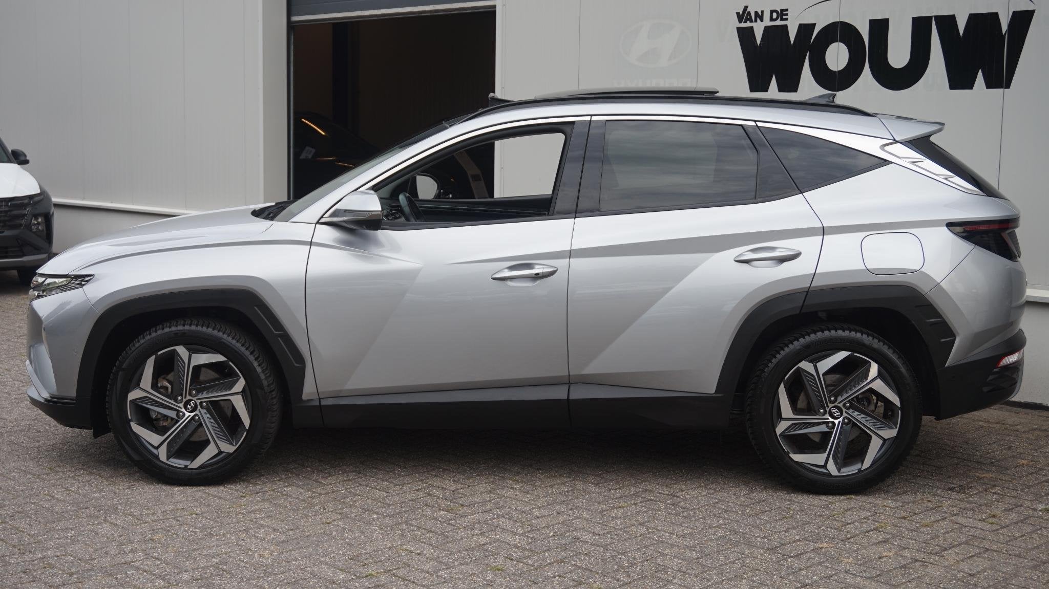 Hyundai Tucson 1.6 T-GDI HEV Premium Sky | Org NL Auto | All, Auto's, Gebruikt, Euro 6, 4 cilinders, 1650 kg