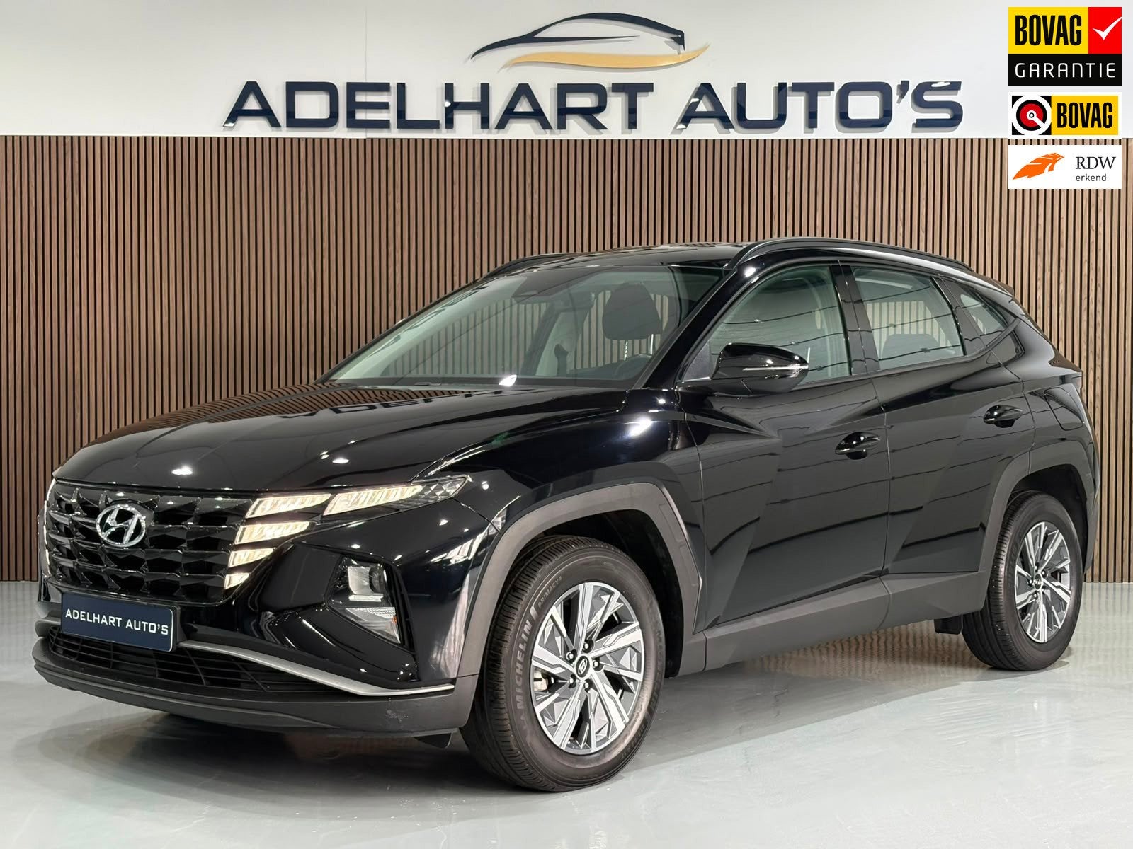 Hyundai Tucson 1.6 T-GDI HEV Comfort 230 PK Automaat / Navig, Auto's, Gebruikt, 4 cilinders, Zwart, Origineel Nederlands
