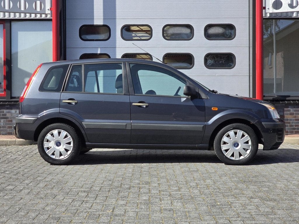 Ford Fusion 1.4-16V Cool & Sound Airco/Trekhaak/AUX, Auto's, Ford, Voorwielaandrijving, Gebruikt, Zwart, Elektrische ramen