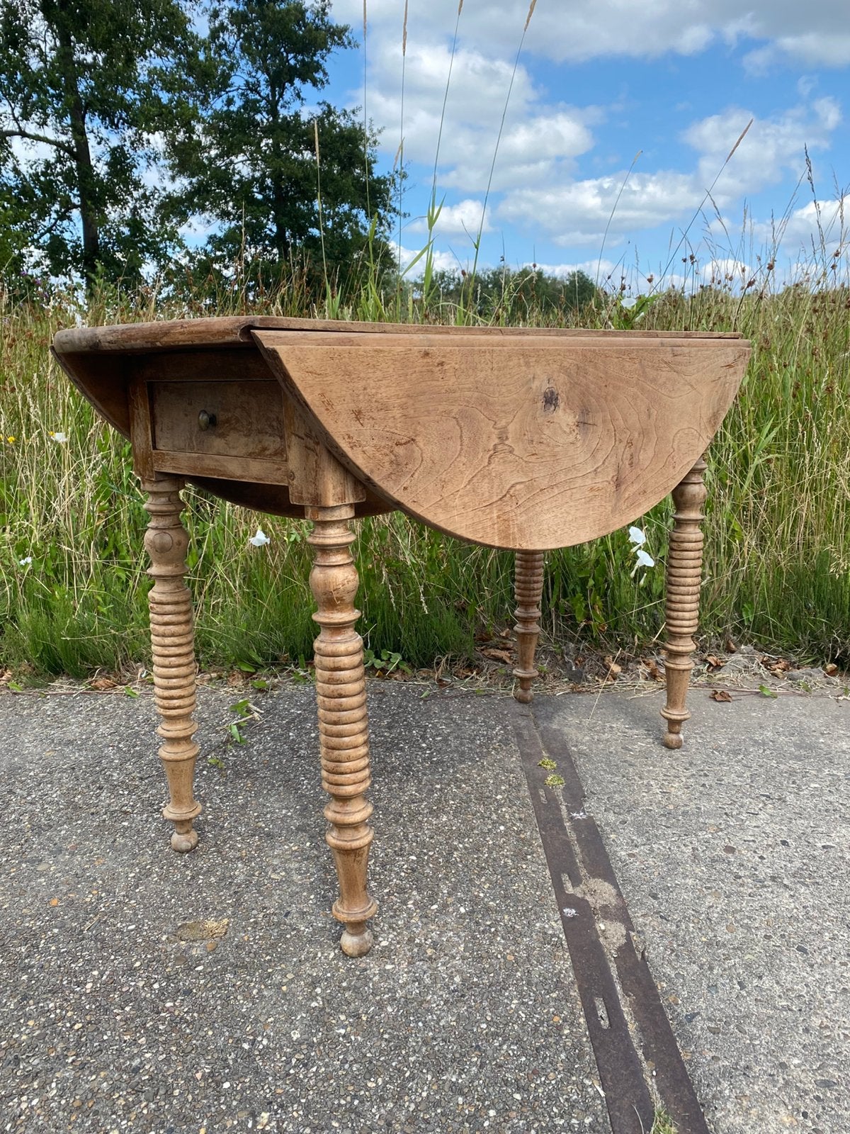 Ovale teakhouten hangoortafel, Ophalen