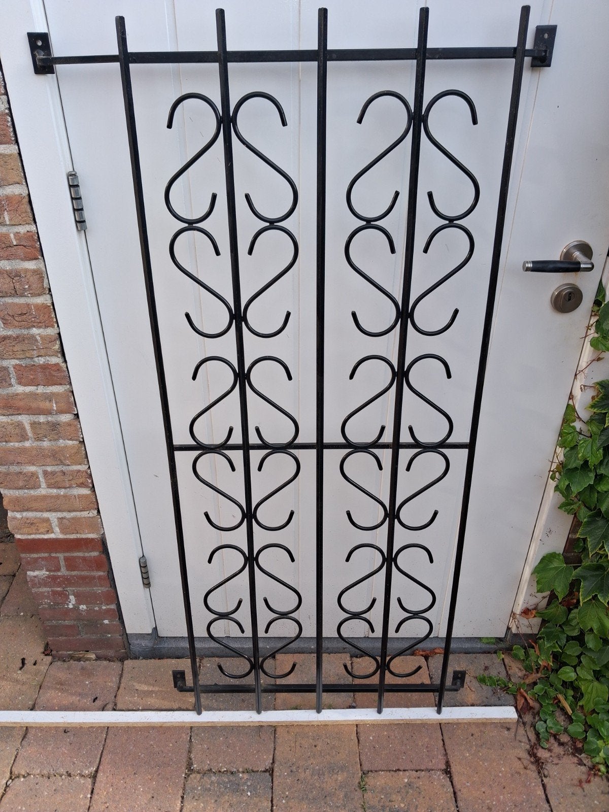 Decoratief smeedijzeren hekwerk voor deur of raam, Ophalen
