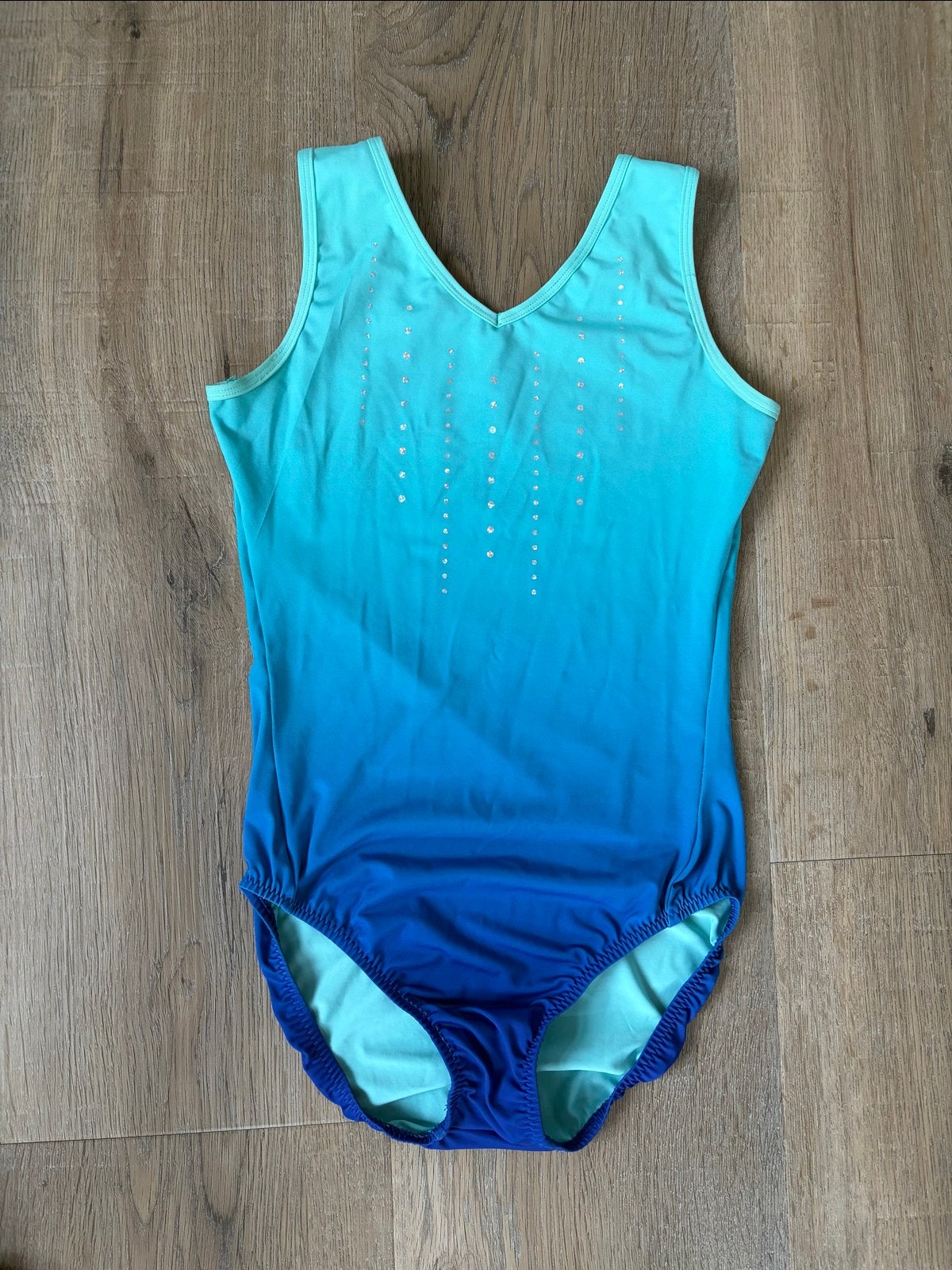 Turnpakje blauw/turquoise met glitters, Sport en Fitness, Blauw, Ophalen of Verzenden, Zo goed als nieuw, Turnpak(je)