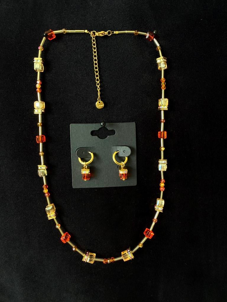 WK topper! RVS ketting/oorbellen set naar luxe merk., Ophalen of Verzenden, Nieuw, Oranje, Overige materialen
