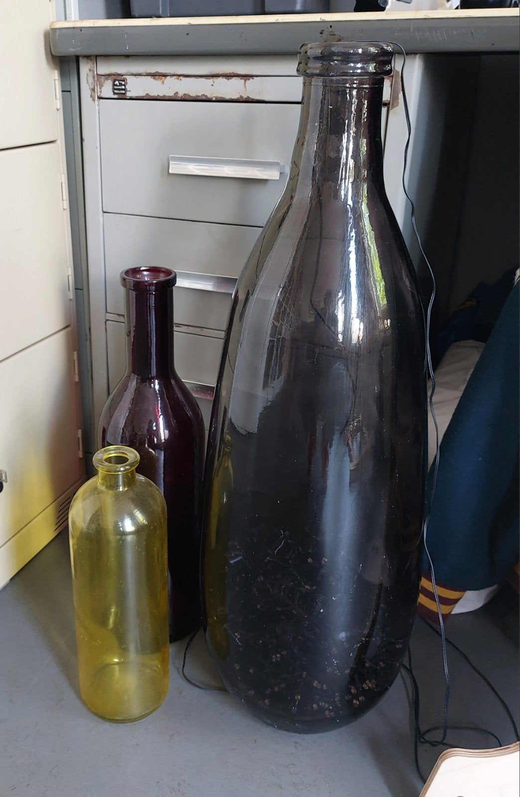 Grote glazen flessen (3 stuks), Ophalen