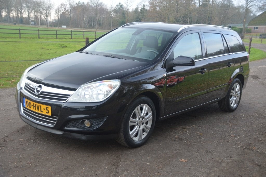 Opel Astra Wagon 1.6 Cosmo Leer PDC Navi (bj 2009), Auto's, Voorwielaandrijving, 15 km/l, Gebruikt, Parkeersensor
