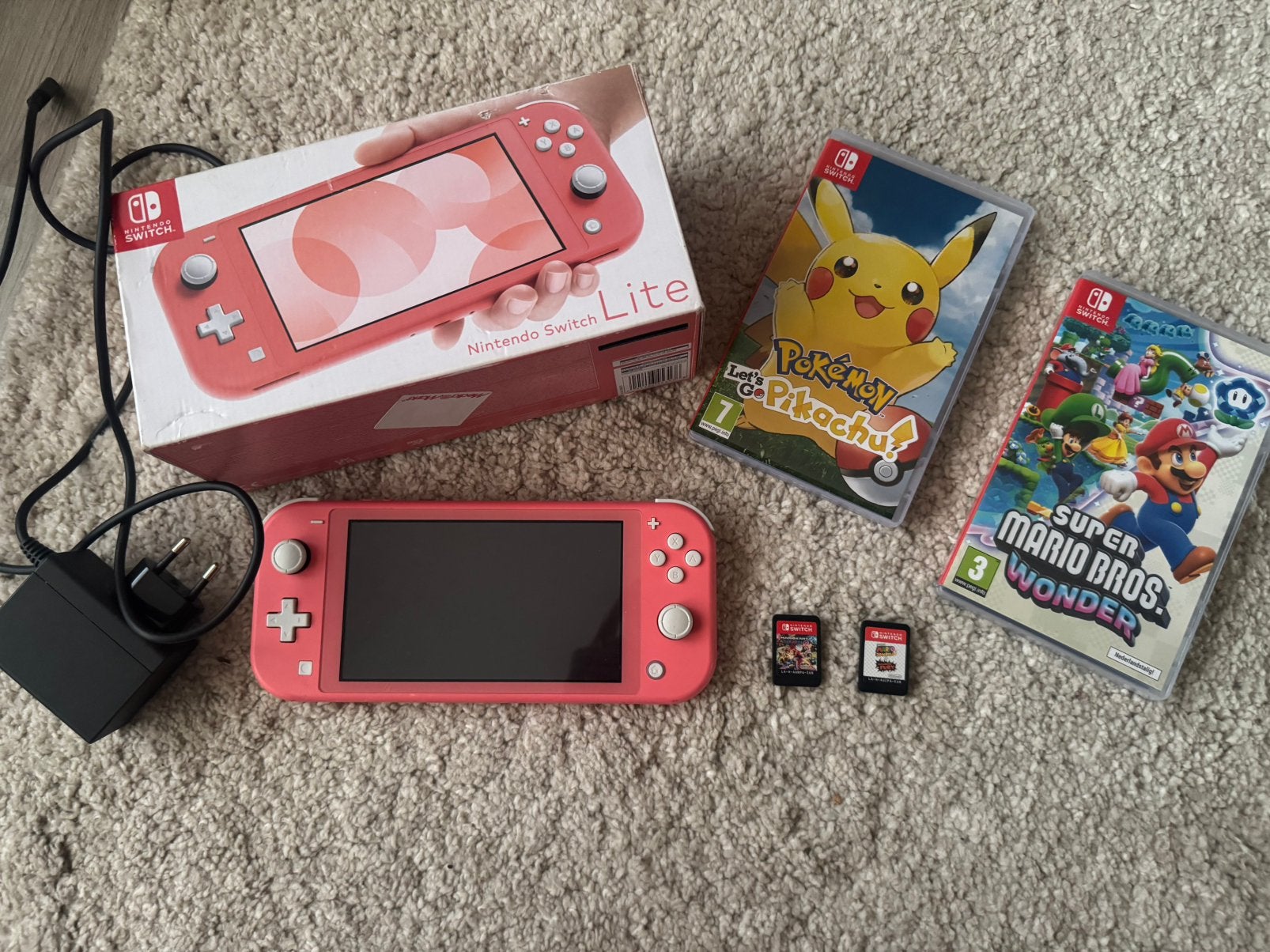 Nintendo switch lite koraal + 4 games, Spelcomputers en Games, Spelcomputers | Nintendo Switch Lite, Ophalen of Verzenden, Roze of Coral