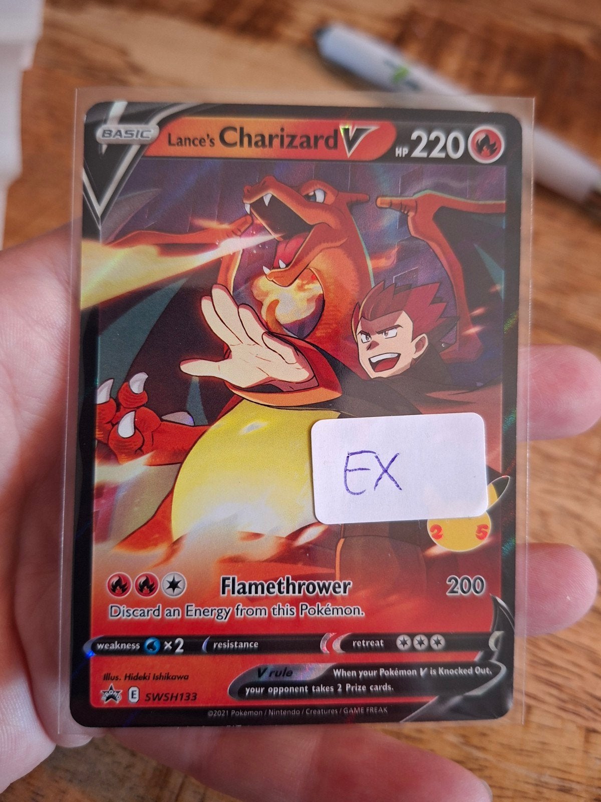 Lance's Charizard V SWSH133 Pokémon Kaart, Ophalen of Verzenden, Zo goed als nieuw, Losse kaart