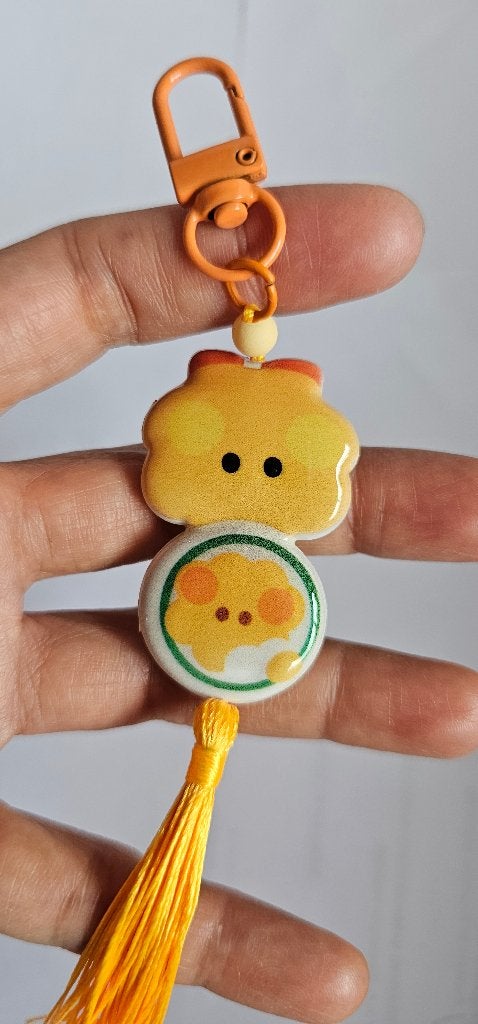 Leuke sleutelhanger met kuiken bt21, bts design en kwastje, Ophalen of Verzenden, Nieuw, Dier of Natuur