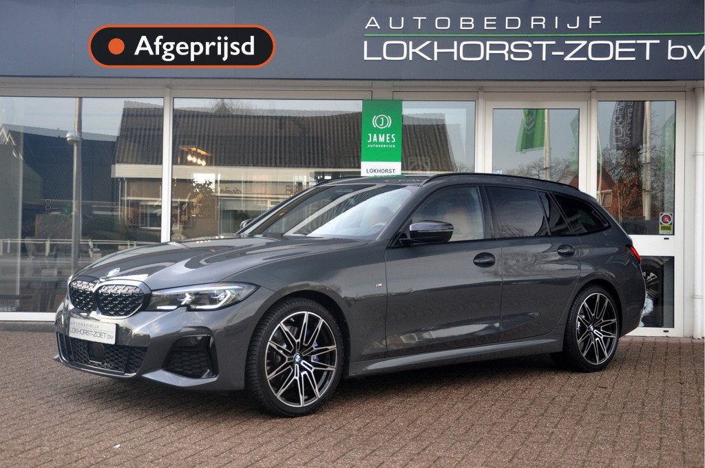 BMW 3 Serie Touring M340i xDrive | Dravit Grau | Panoramadak, Automaat, 1780 kg, Vierwielaandrijving, Hybride Elektrisch/Benzine