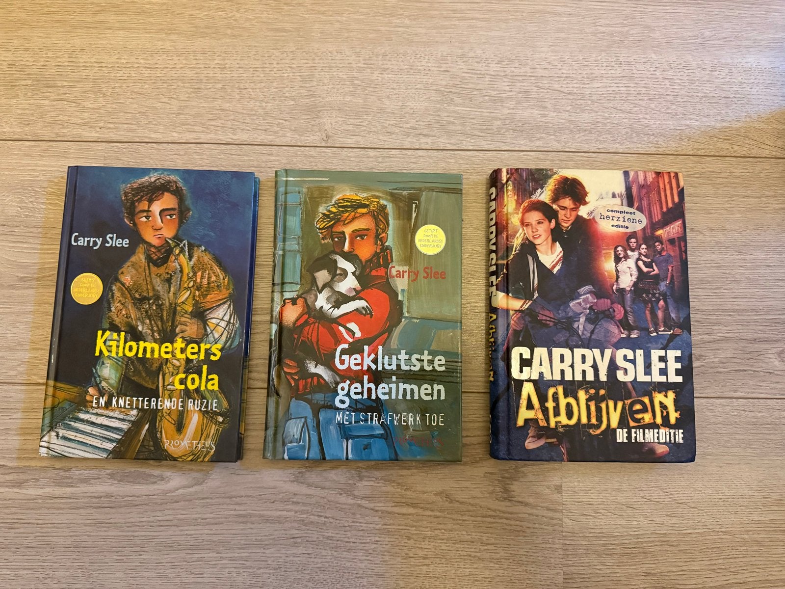 3 jeugdboeken van Carry Slee: Kilometers Cola, Geklutste Geh, Ophalen of Verzenden, Zo goed als nieuw, Fictie algemeen