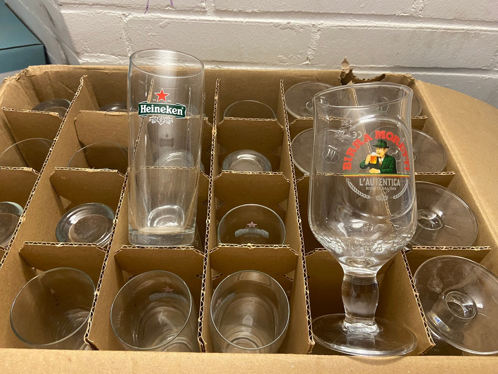 17 Heineken Ellipse Core bierglazen 22cl fluitje, Ophalen of Verzenden, Zo goed als nieuw, Bierglas
