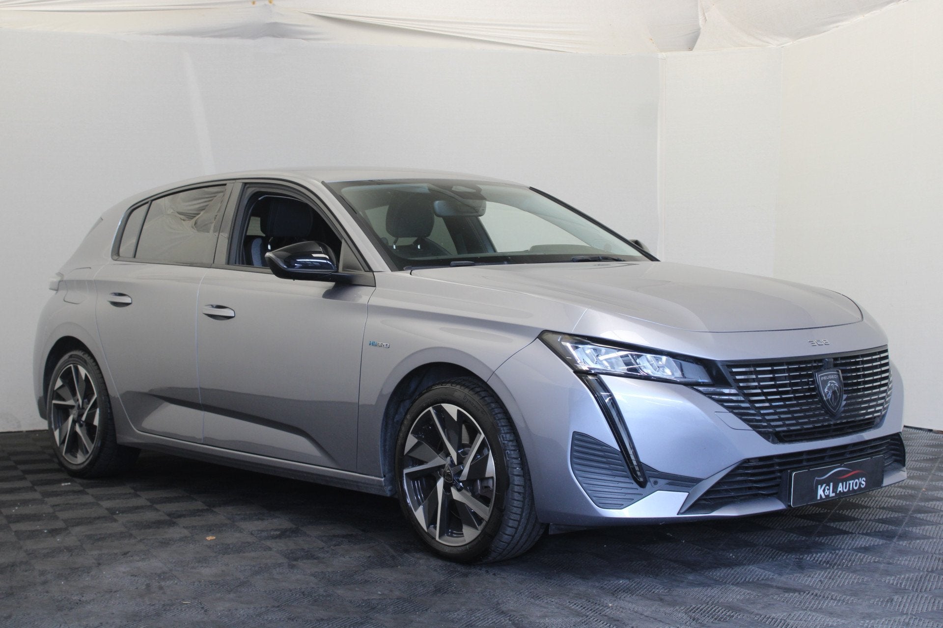 Peugeot 308 1.6 Plug-in Hybrid 180 Allure (bj 2023), Auto's, Parkeersensor, Gebruikt, 4 cilinders, Leder en Stof