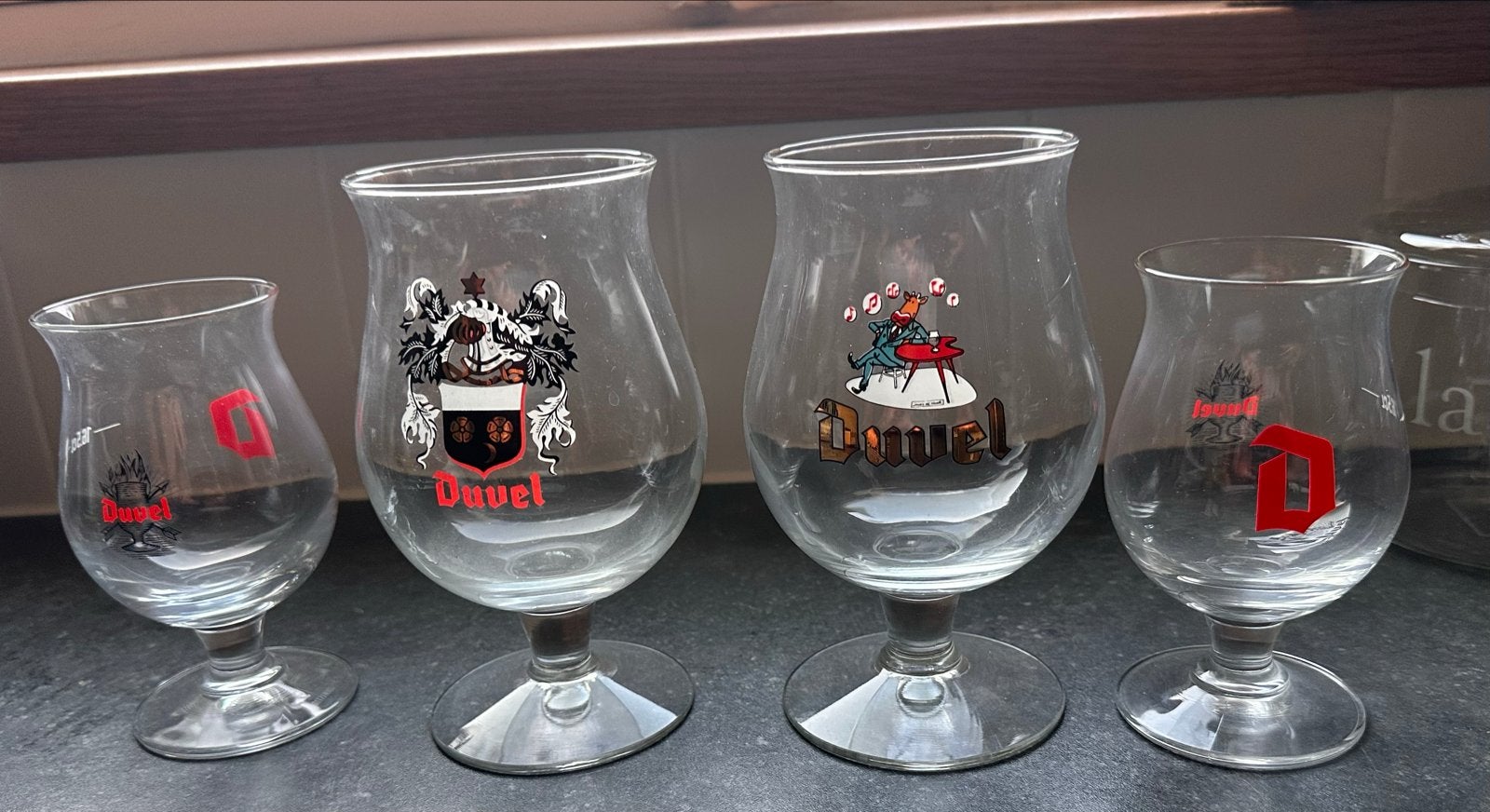4 Duvel glazen - Diverse ontwerpen, Verzenden, Gebruikt