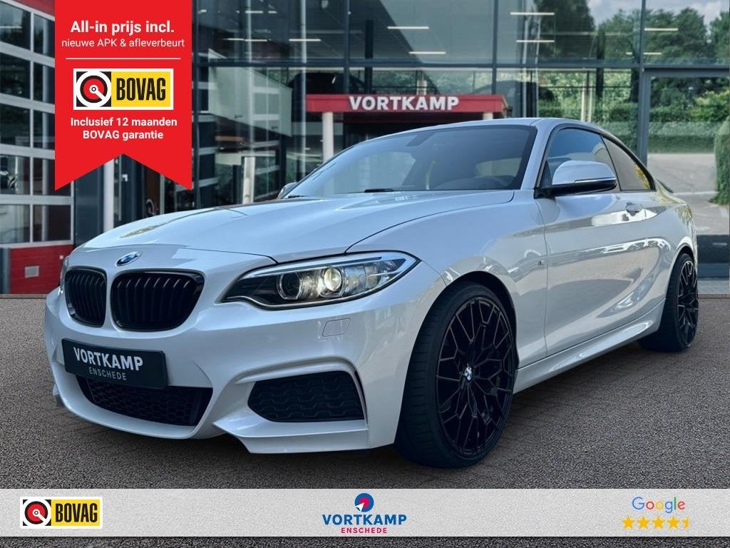 Bmw 2-SERIE 218i M-PAKKET NAVI/LEDER/CRUISE/PDC/STOELVERW, Auto's, BMW, 680 kg, Met garantie (alle), 4 stoelen, Wit