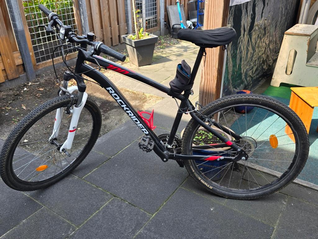 Rockrider ST100 mountainbike met slot, Ophalen