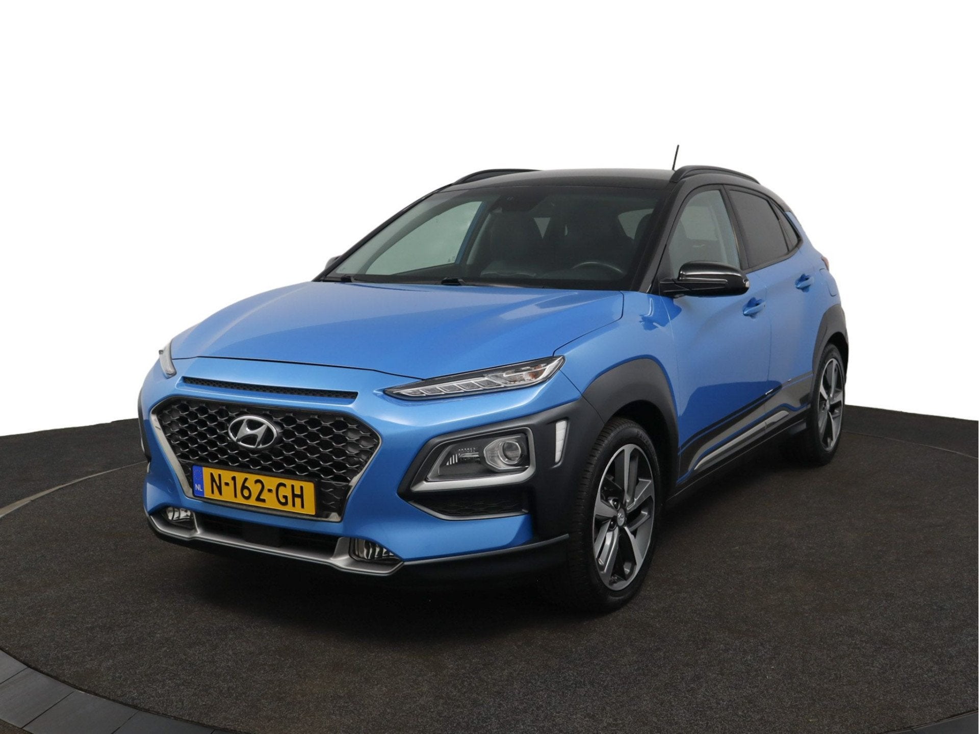 Hyundai KONA 1.0T Premium - Elektrische Stoelen - Trekhaak -, Auto's, Voorwielaandrijving, Gebruikt, Blauw, Leder