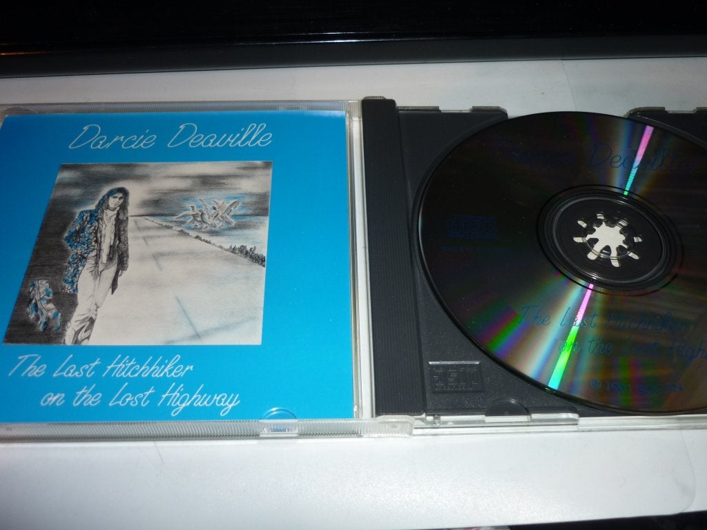 Darcie Deaville - The Last Hitchhiker on the Lost Highway CD, Singer-songwriter, Ophalen of Verzenden, Zo goed als nieuw, Inclusief boekje