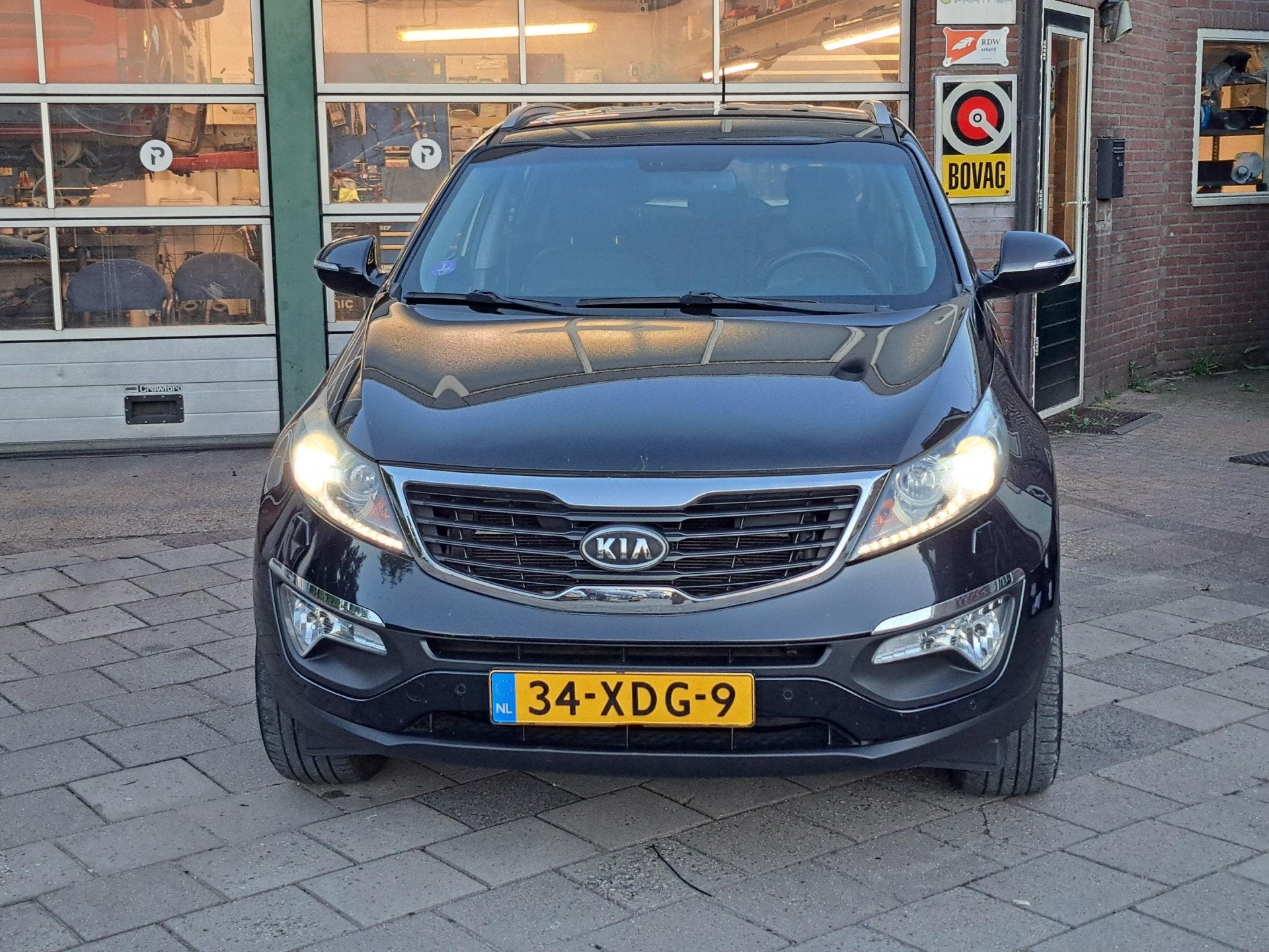 Kia Sportage 1.6 GDI Super Pack/Trekhaak/Leer/Navi, Auto's, 135 pk, 4 cilinders, Zwart, 1200 kg
