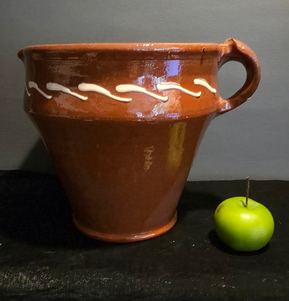 Traditionele beslagpot of vuurtest, Ophalen