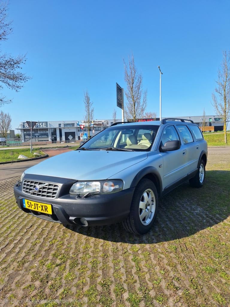 Volvo V70 2.4 T XC 4WD AUT 2002 Blauw, Auto's, 1800 kg, Beige, Blauw, Stationwagon