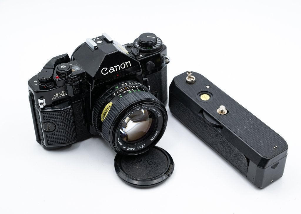 Canon A-1 + Canon FD 50mm f/1.4 + Grip Motor Drive, Ophalen of Verzenden, Gebruikt, Spiegelreflex, Canon