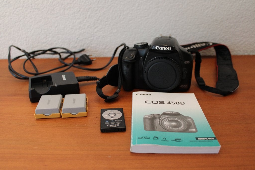 Canon EOS 450D body met 2 accu's, lader en afstandsbediening, Draagriem, Gebruikt, Spiegelreflex, Canon
