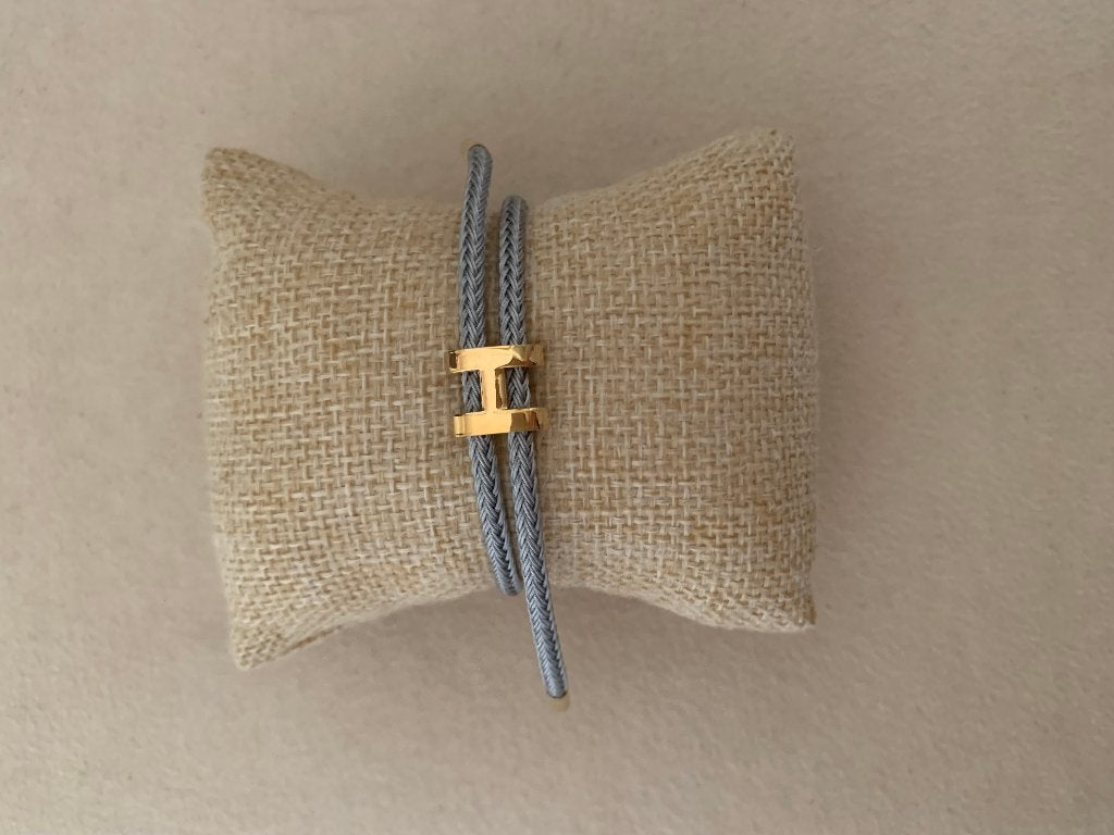 Grijze armband met gouden letter H armband waterproof, Staal, Nieuw, Ophalen of Verzenden, Met bedels of kralen