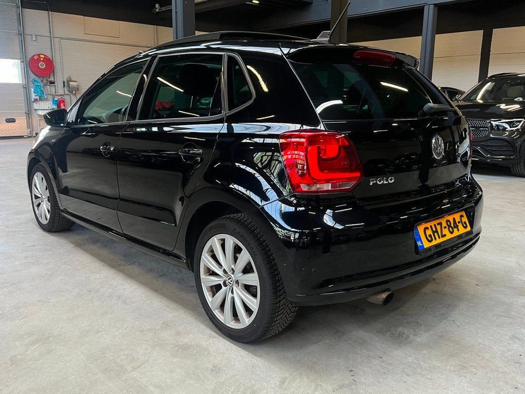 Volkswagen Polo 1.2 TSI Highline Automaat/Pano/Navi/, Auto's, Volkswagen, Gebruikt, Zwart, 4 cilinders, Leder en Stof