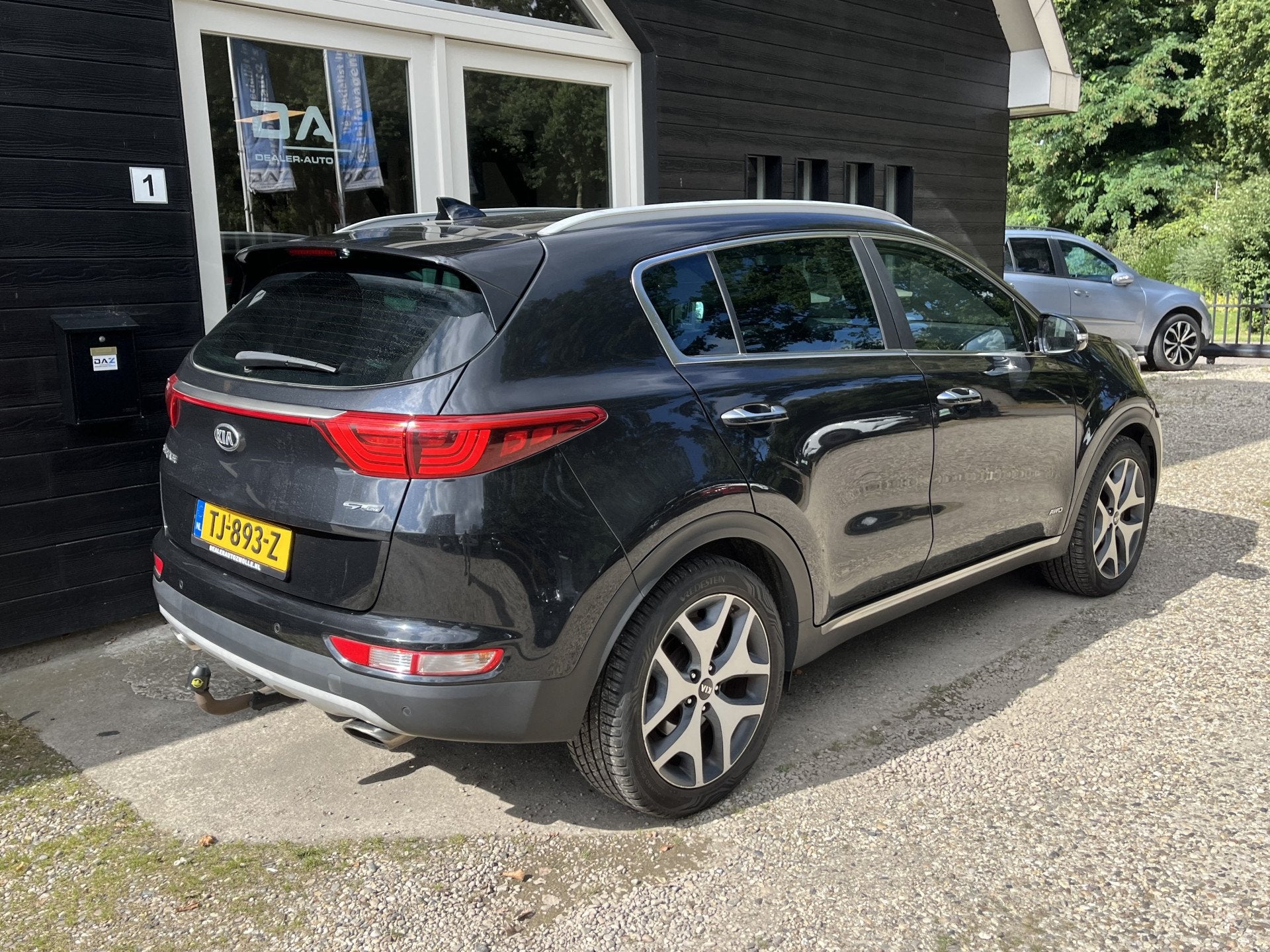 Kia Sportage 1.6 T-GDI 4WD GT-Line Aut/Ecc/Leer/Navi/Pano/Tr, Gebruikt, 4 cilinders, Zwart, Bedrijf