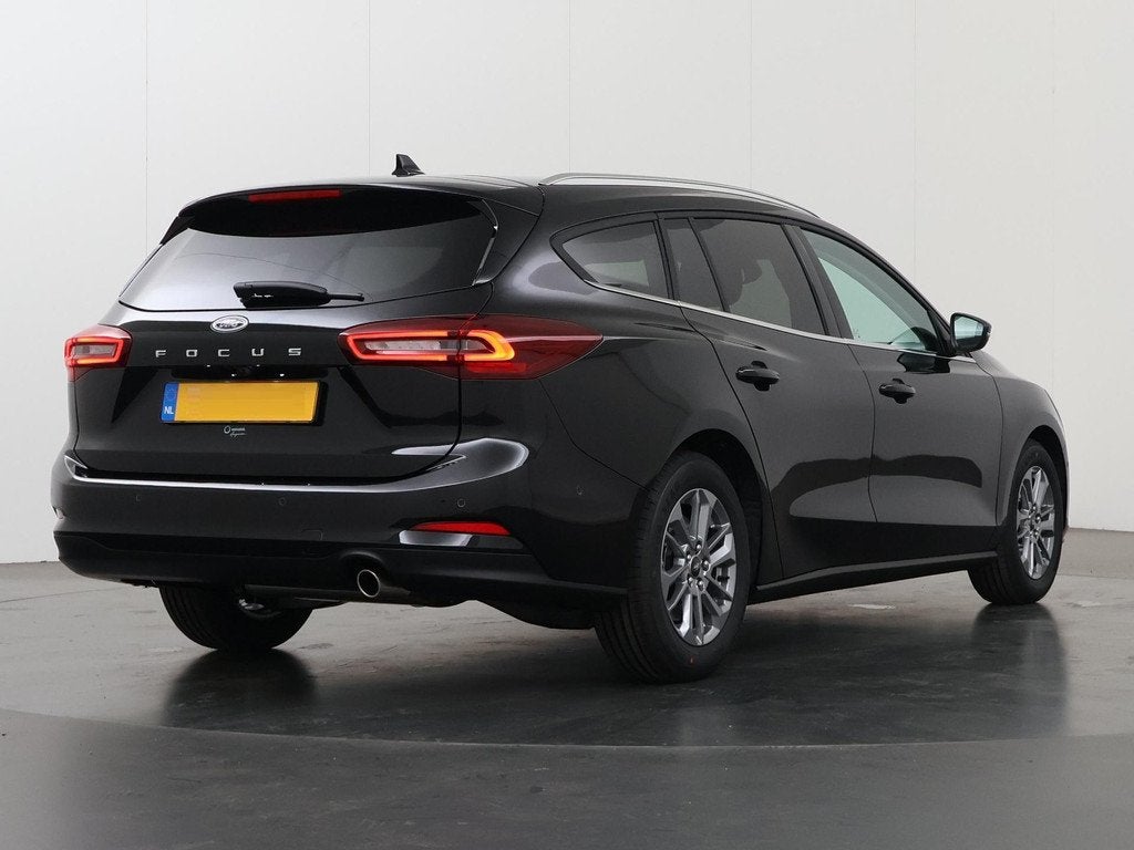 Ford Focus Wagon 1.0 EcoBoost Hybrid Titanium Winterpack, Auto's, Zwart, Origineel Nederlands, Handgeschakeld, 19 km/l