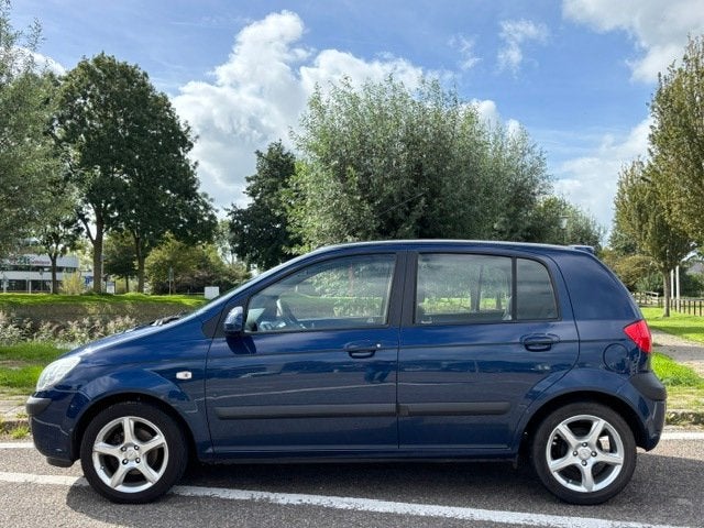 Hyundai Getz 1.4i Active Joy 5-Drs Airco Electric pakket Aud, Auto's, Voorwielaandrijving, Dealer onderhouden, 4 cilinders, Blauw