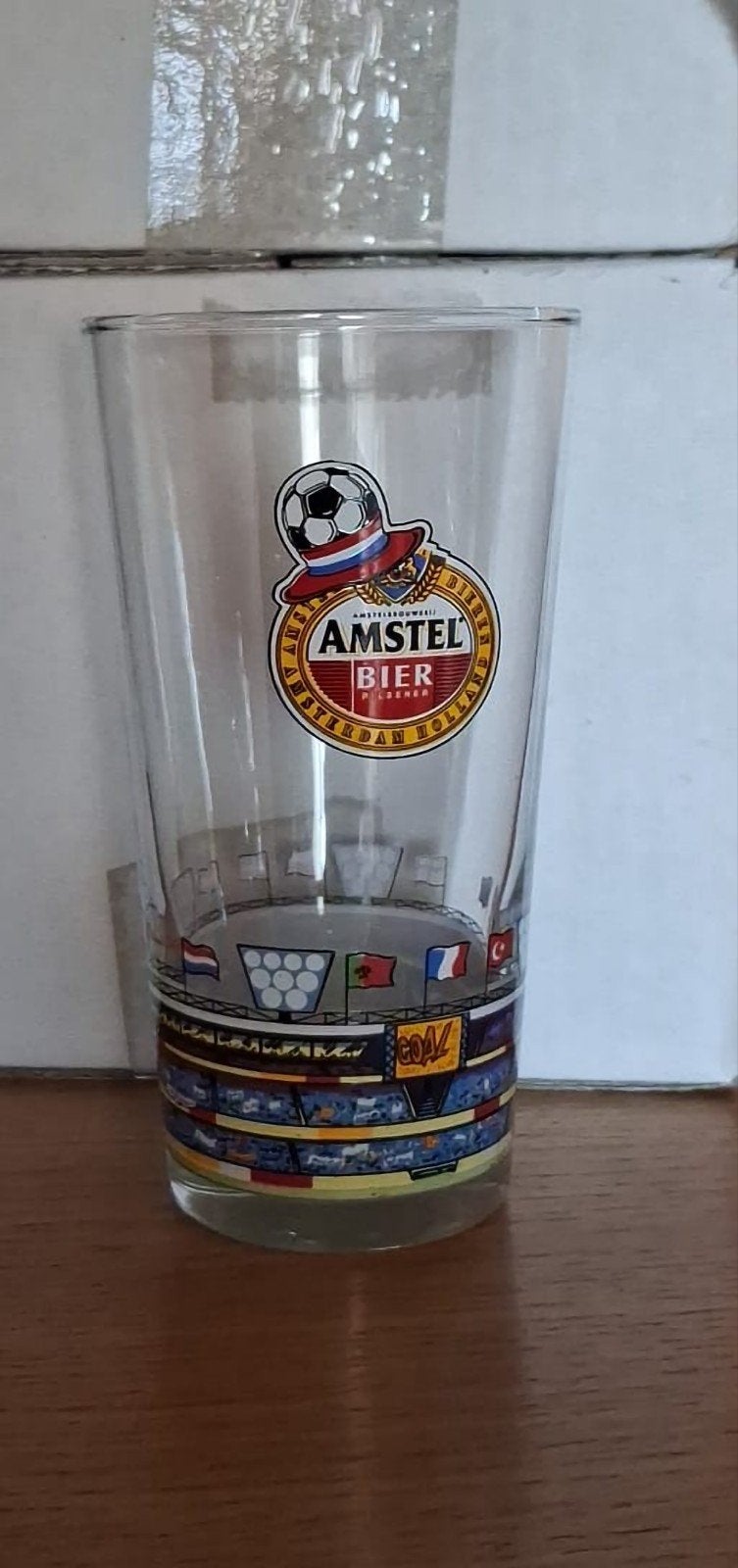 12 nieuwe dezelfde Amstelbier glazen nog in doos, Ophalen, Zo goed als nieuw, Bierglas