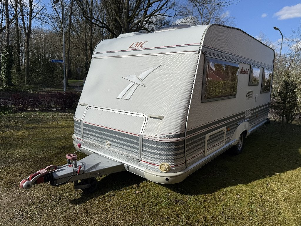 LMC Munsterland 490K1 Frans bed Airco 2002, Caravans en Kamperen, Rondzit, Particulier, 4 tot 5 meter, Vast bed