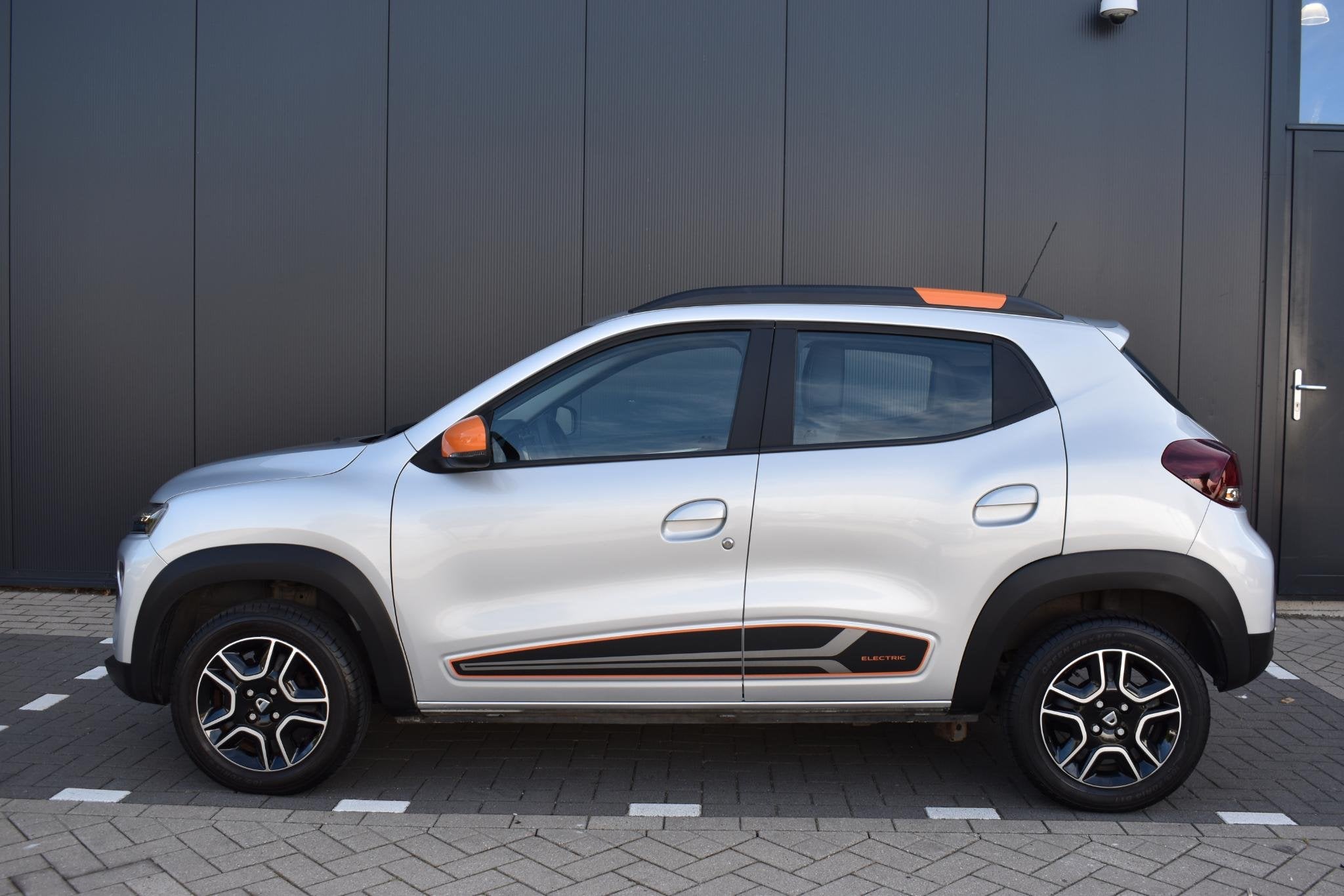 Dacia Spring Comfort Plus (Orange Pack) 27 kWh NAVIGATIE | C, Auto's, Gebruikt, 38 min, Leder en Stof, Te koop