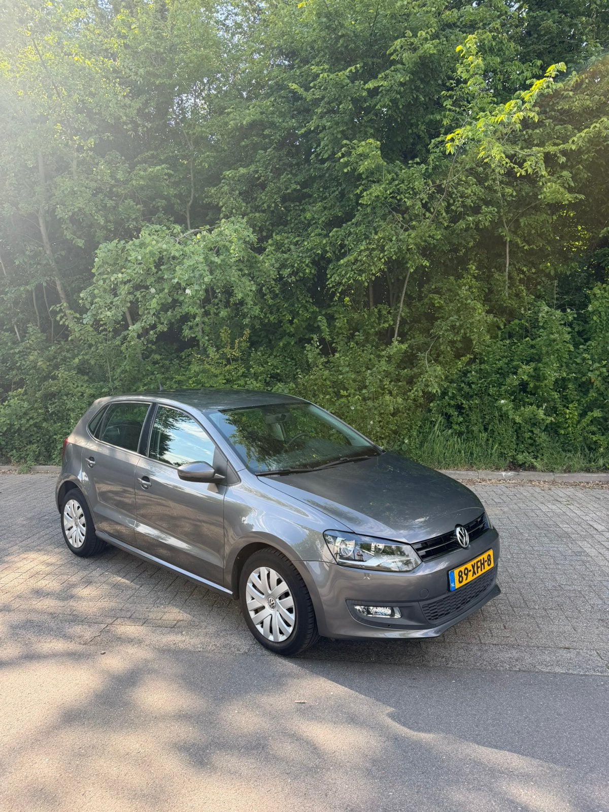 Volkswagen Polo 1.2 TSI Bluemotion Comfort Edition NAP, Stof, Zwart, Start-stop-systeem, Handgeschakeld