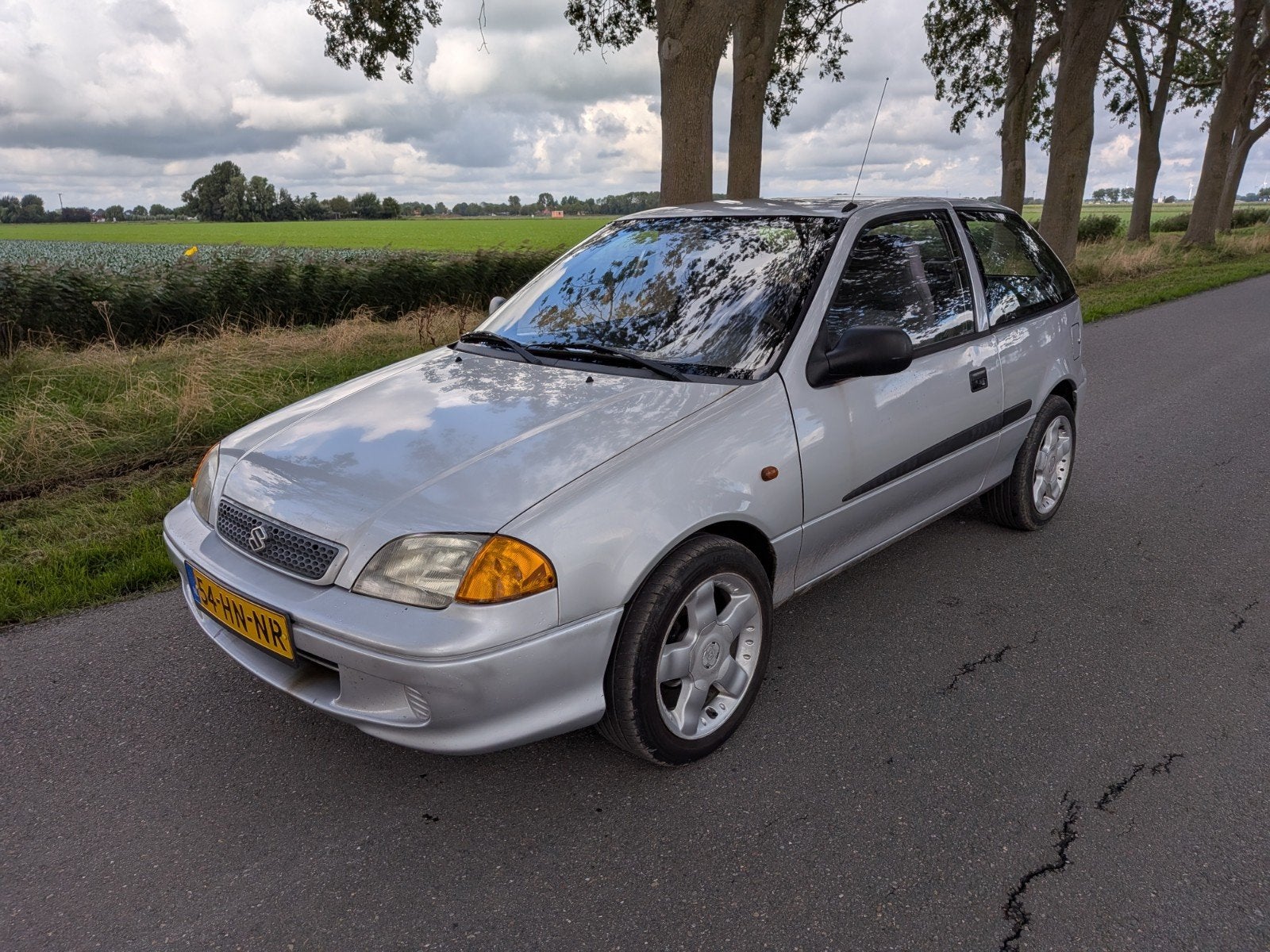 Suzuki Swift 1.3 2001 Grijs nieuwe apk! airco! lichtmetaal!, Voorwielaandrijving, Stof, Elektrische ramen, 4 cilinders
