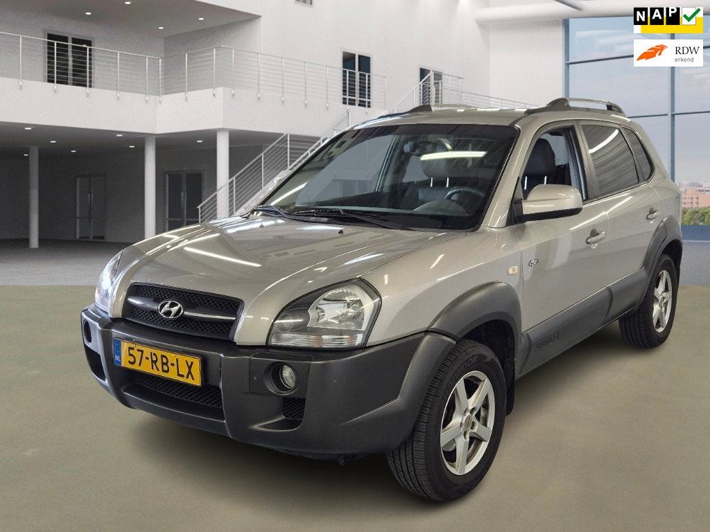 Hyundai Tucson 2.7i V6 4WD Style, Auto's, Automaat, Gebruikt, 2656 cc, Bedrijf