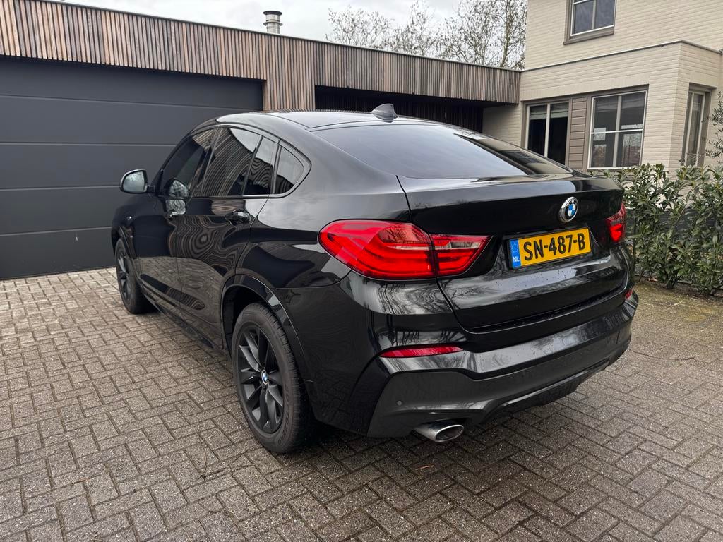 BMW X4 xDrive20da Zwart, Auto's, Automaat, 1995 cc, USB, Zwart