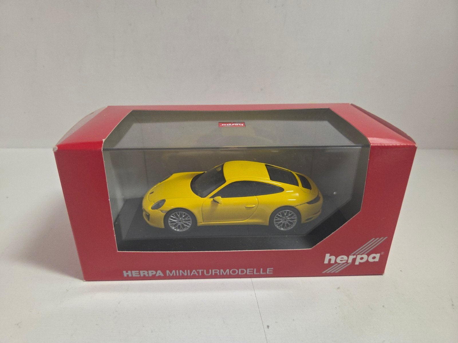 Herpa Porsche 911 Carrera 4S Coupé 1:43, Hobby en Vrije tijd, Overige merken, Auto, ., Ophalen of Verzenden