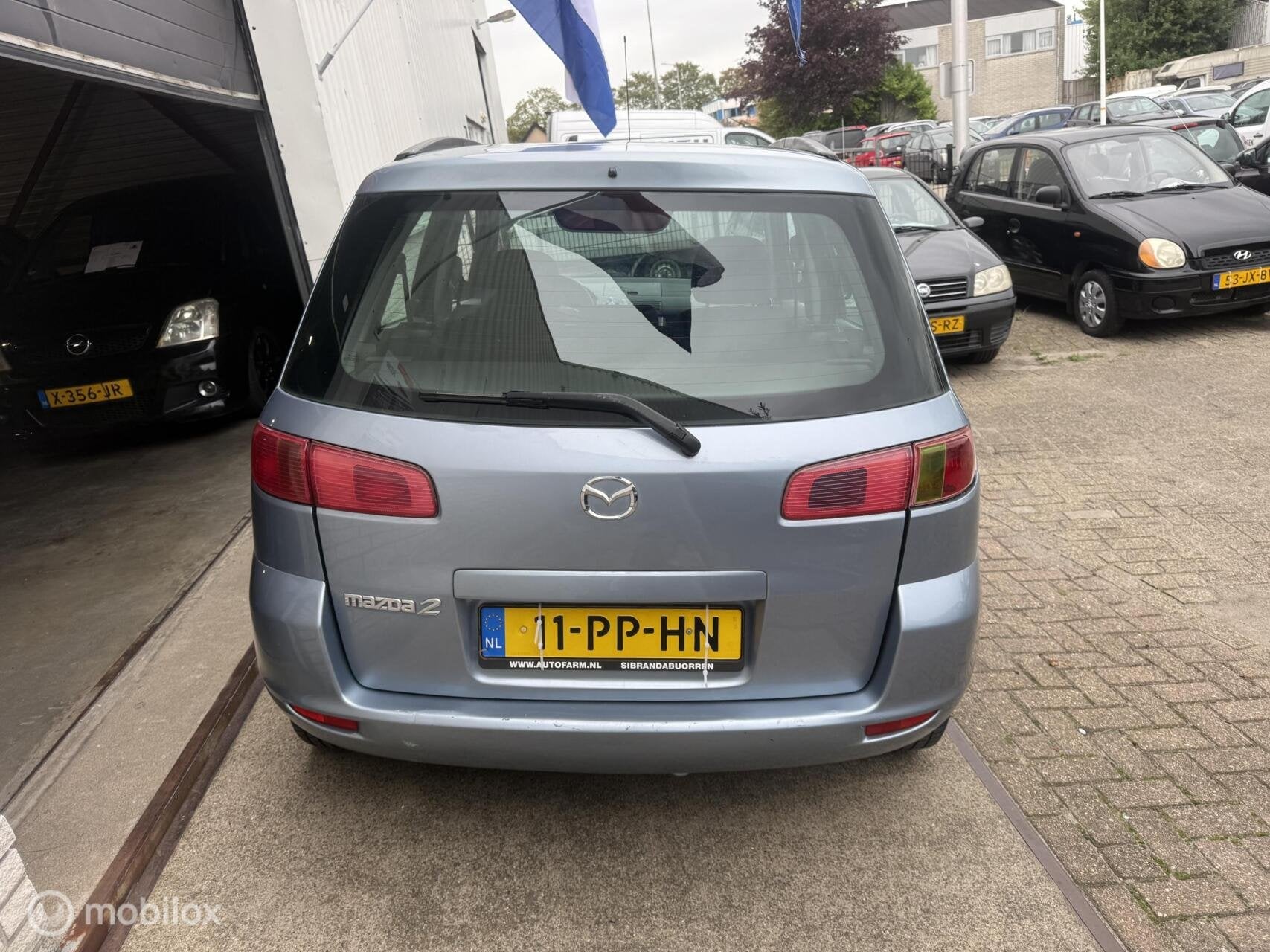 Mazda 2 1.4 Exclusive, Auto's, 4 cilinders, Blauw, Bedrijf, 1035 kg