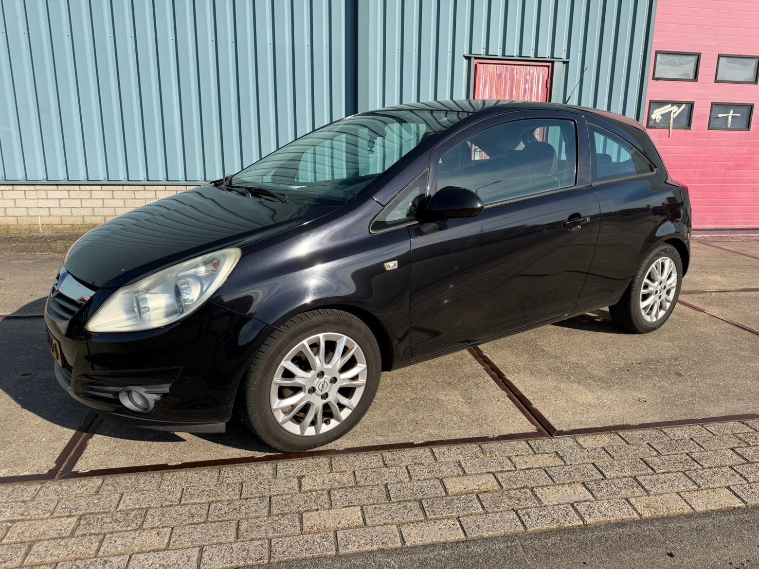 Opel Corsa 1.4 2009 Zwart, Auto's, Voorwielaandrijving, Stof, Zwart, 4 cilinders
