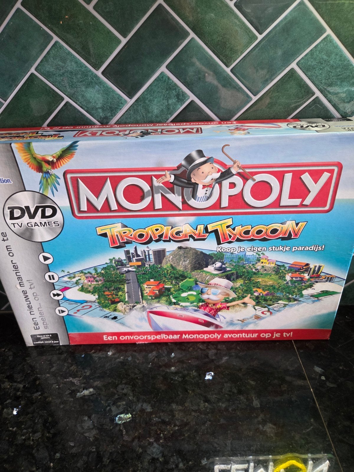 Monopoly Tropical Tycoon PARKER - Compleet met DVD, Hobby en Vrije tijd, Drie of vier spelers, Ophalen of Verzenden, Zo goed als nieuw