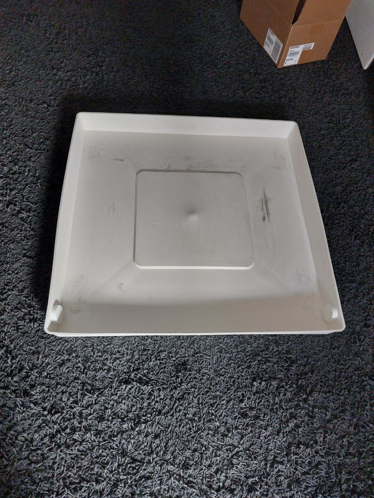 Lekbak voor wasmachine, Ophalen