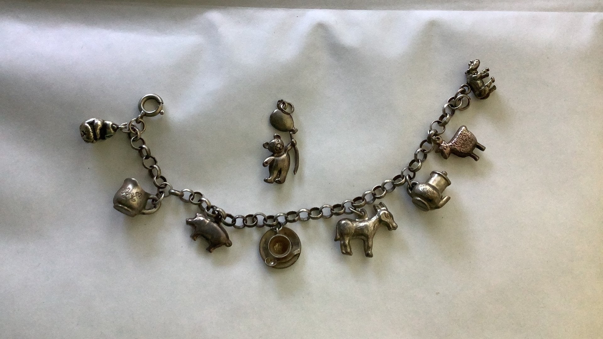 Zilver oude kinder bedelarmband, 9 bedels, Ophalen of Verzenden, Zo goed als nieuw, Zilver