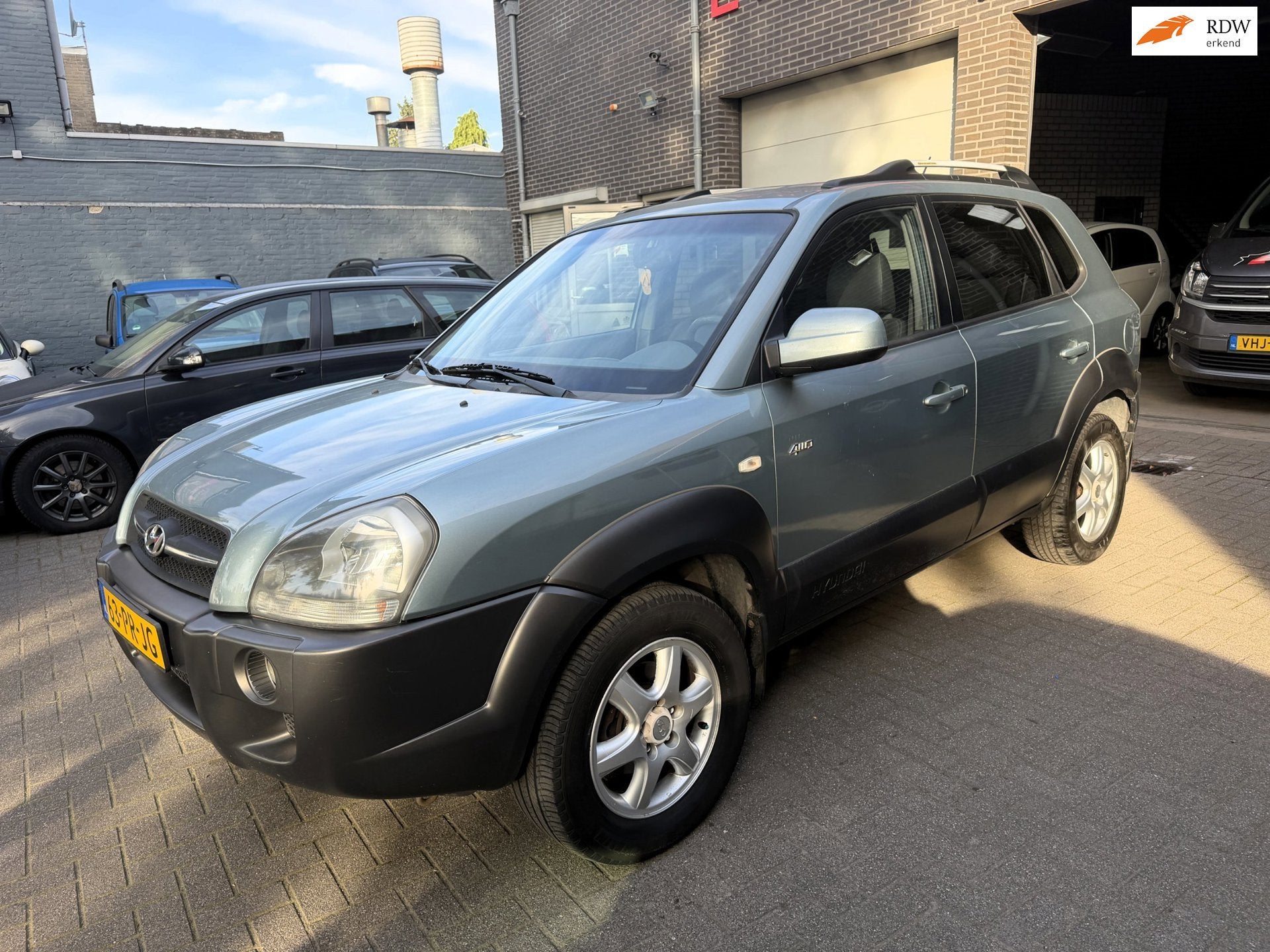 Hyundai Tucson 2.7i V6 4WD Style, Auto's, Automaat, Gebruikt, 2656 cc, Bedrijf