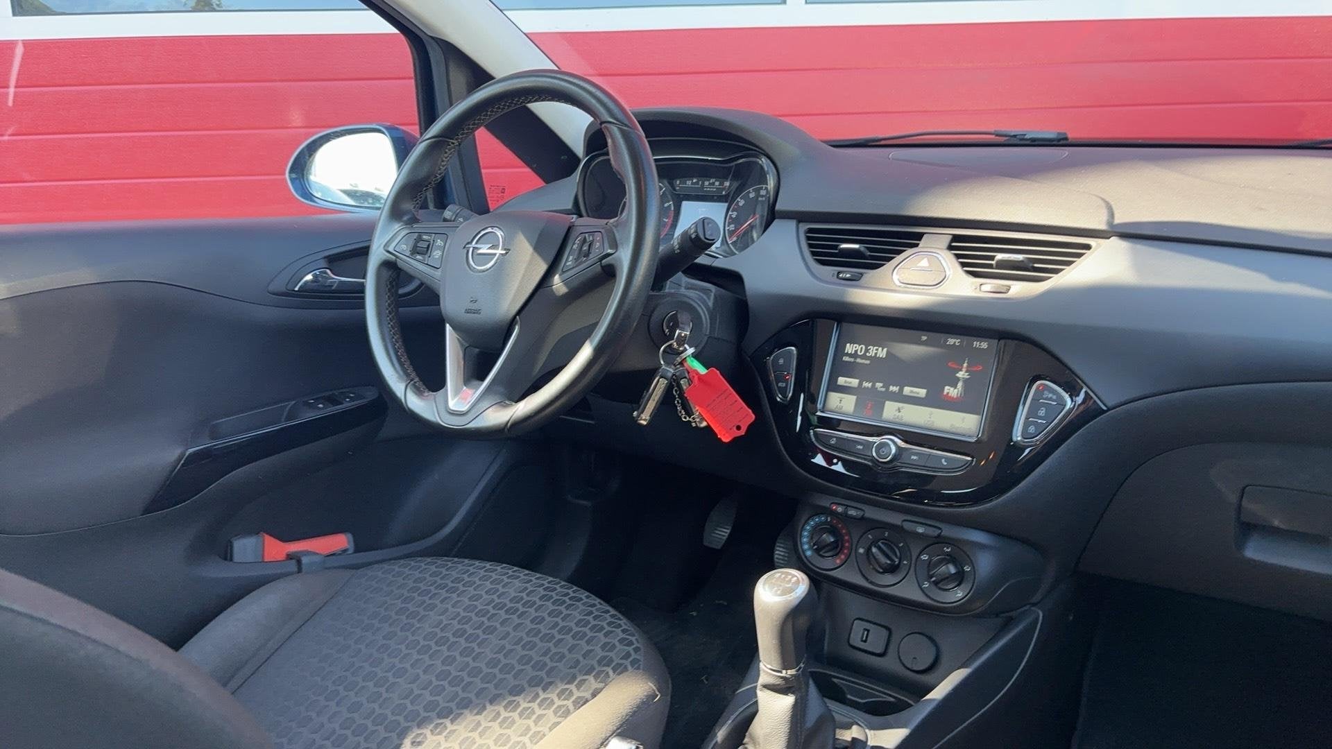 Opel Corsa 1.4 Edition TREKHAAK / CARPLAY / CAMERA / PDC / B, Voorwielaandrijving, Gebruikt, 4 cilinders, Blauw