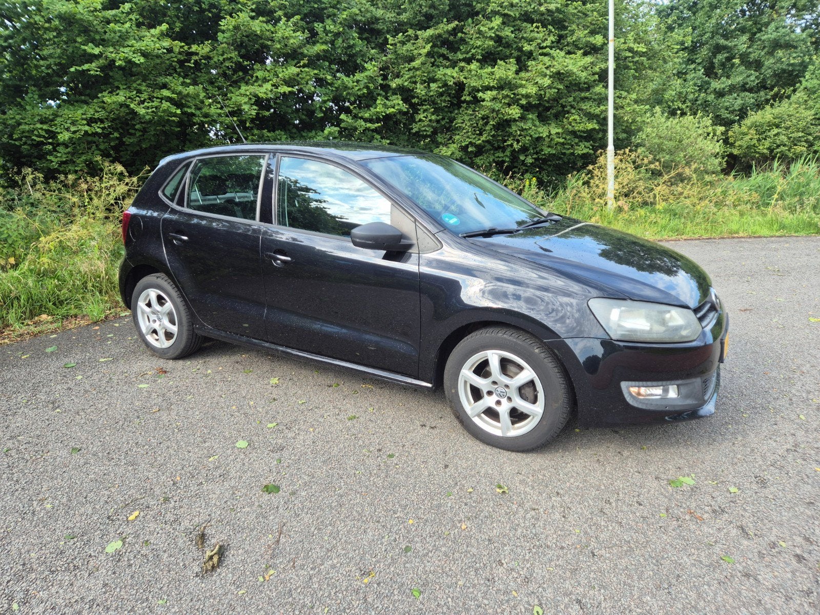 Volkswagen Polo 1.2 TSI 66KW 2012 Zwart, Auto's, Volkswagen, Voorwielaandrijving, Stof, 40 €/maand, Zwart